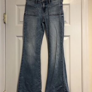 High-Rise Light Blue Flare Jeans with Patch Pockets